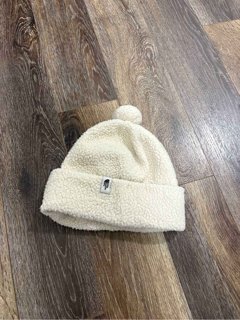 The North Face Cragmont Fleece Beanie in Gardenia White. S/M